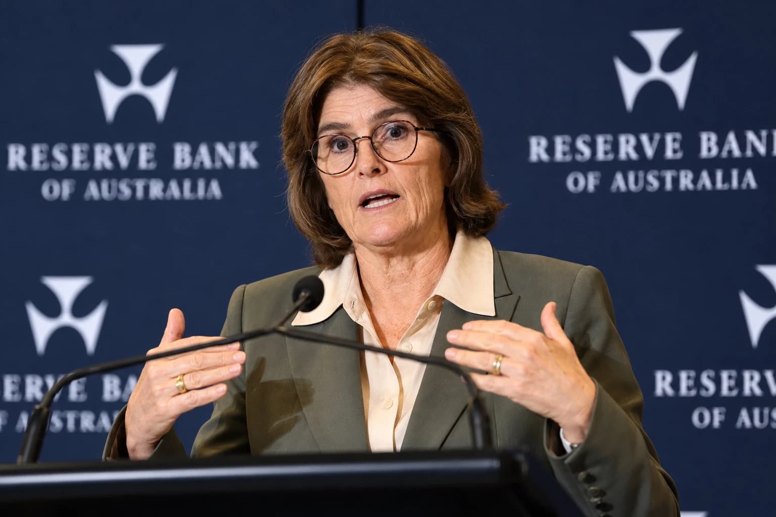 User-supplied AI-generated editorial depiction of RBA Governor Michele Bullock speaking at a lectern