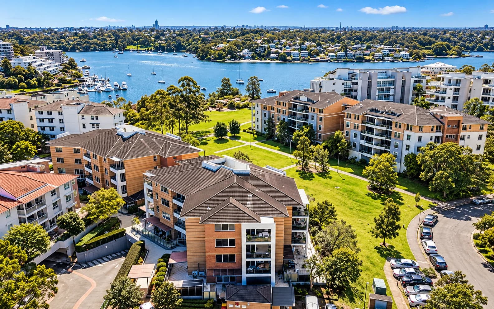 Riverside apartment buildings, gardens and boat moorings