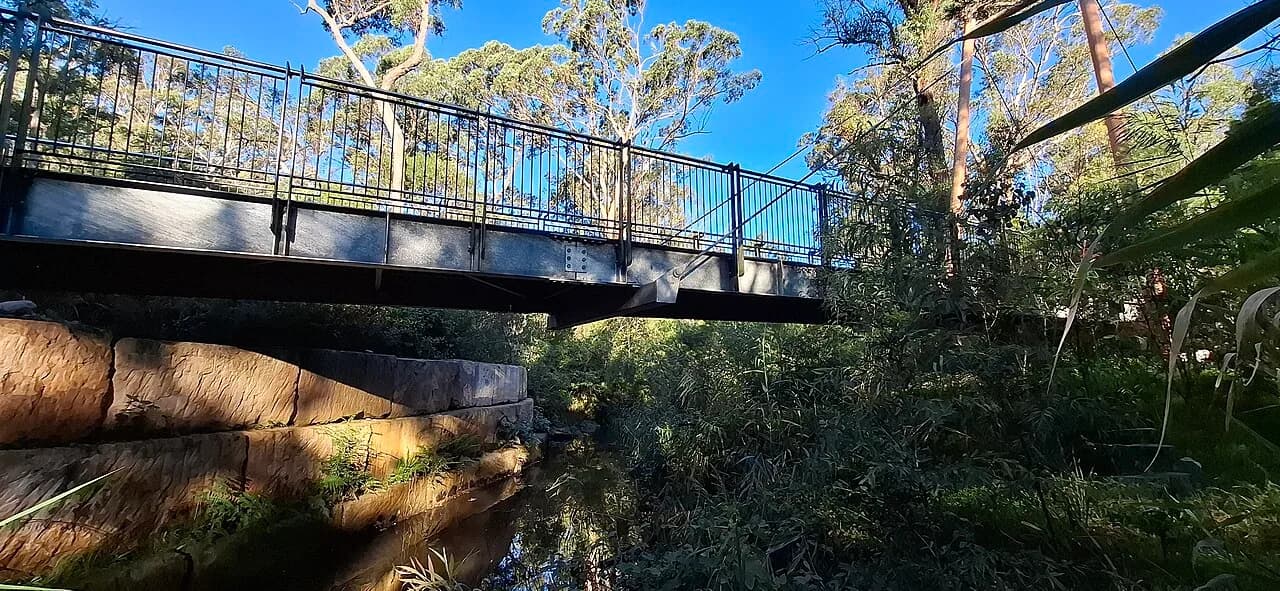 Pedestrian bridge and street setting in North Kellyville