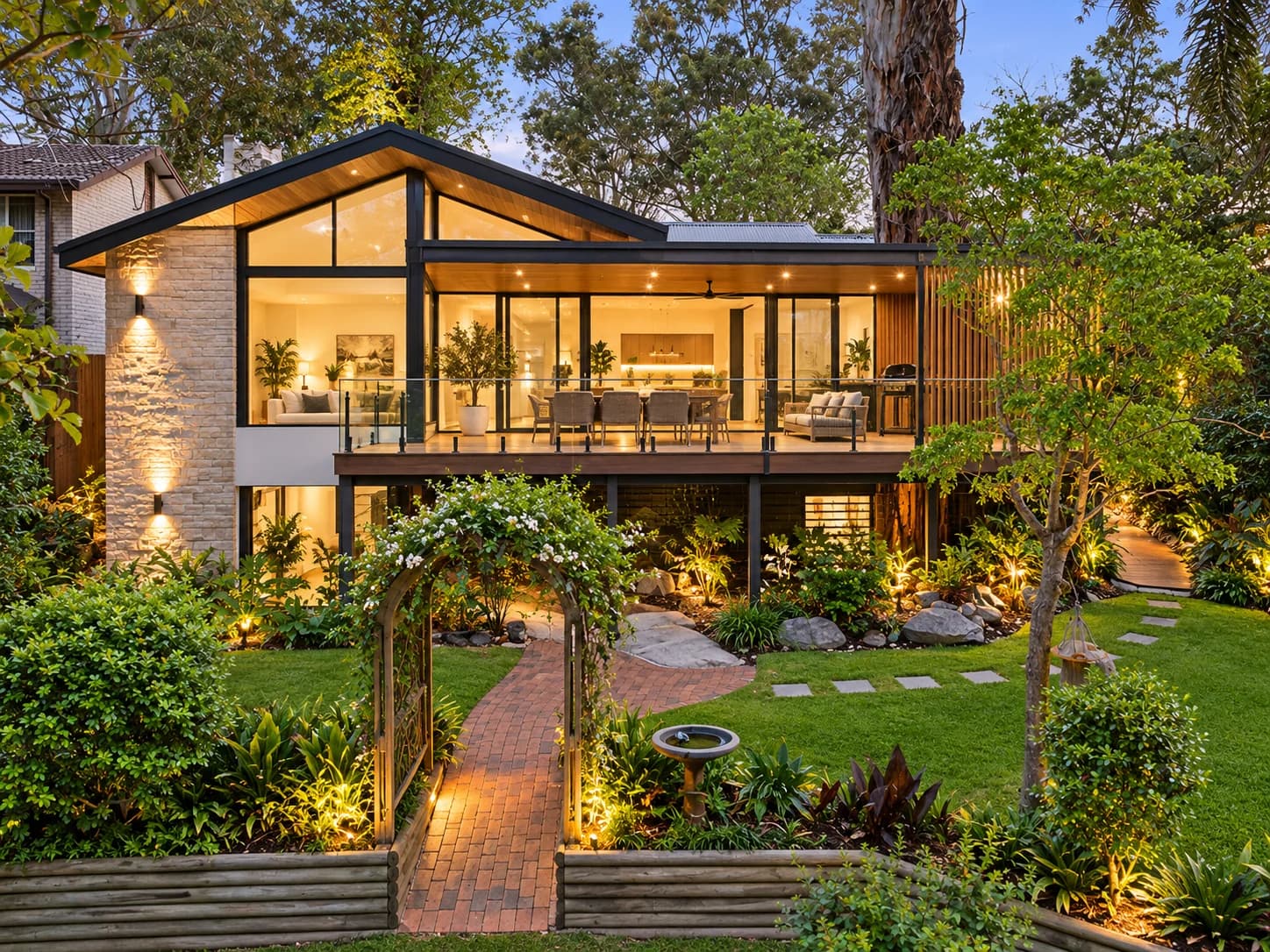 Contemporary house with a landscaped garden at dusk
